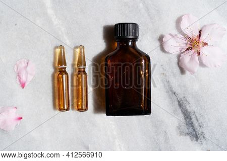 Retinol And Almond Oil Serum Beauty Care, Anti Aging Natural Cosmetic, Mock Up With Bottle And Ampul
