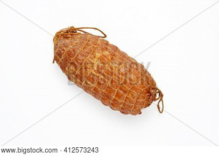 Top View Of A Small, Natural, Smoked Ham In One Piece, In Netting, Isolated On A White Background. H