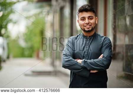 Сonfident Pakistani Indian Muslim Arabic Boy In Grey Kameez Shalwar Suit.
