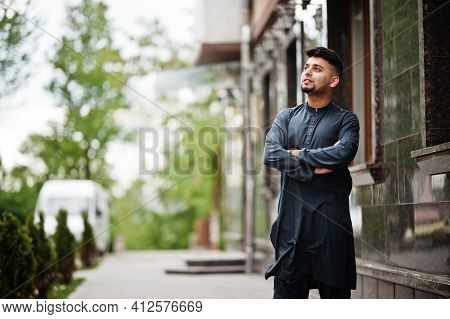 Сonfident Pakistani Indian Muslim Arabic Boy In Grey Kameez Shalwar Suit.