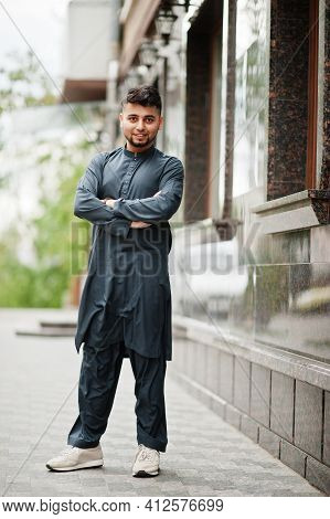 Сonfident Pakistani Indian Muslim Arabic Boy In Grey Kameez Shalwar Suit.