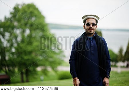 Stylish Pakistani Indian Muslim Arabic Man In Kurta Dhoti Suit, Traditional Pakol Hat And Sunglasses