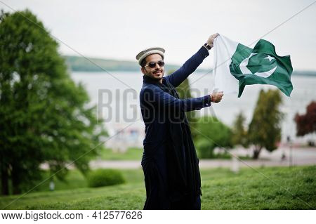 Stylish Pakistani Indian Muslim Arabic Man In Kurta Dhoti Suit, Traditional Pakol Hat And Sunglasses