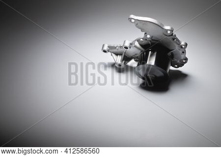 Water Pump Of The Internal Combustion Engine Cooling System. Contrasting On A Gray Gradient