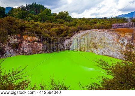 Volcanic Valley Waimangu. Wai-O-Tapu, Devil's Bath with bright green color of water. The unique geothermal area of Rotorua. New Zealand, North Island. Extreme, exotic and photo tourism concept