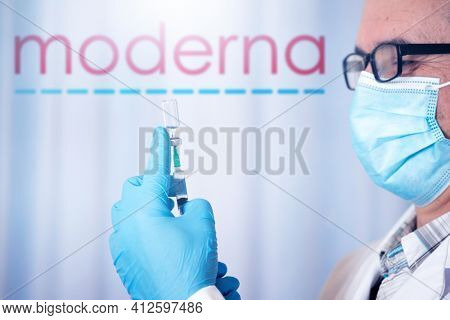 Cluj-Napoca, Romania - March 15, 2021:  New coronavirus vaccine Moderna concept, blurred Moderna logo on the background. Covid-19, 2019-nCov pandemic.
