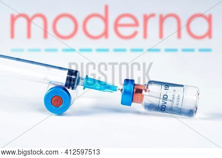 Cluj-Napoca, Romania - March 15, 2021:  New coronavirus vaccine Moderna concept, blurred Moderna logo on the background. Covid-19, 2019-nCov pandemic.
