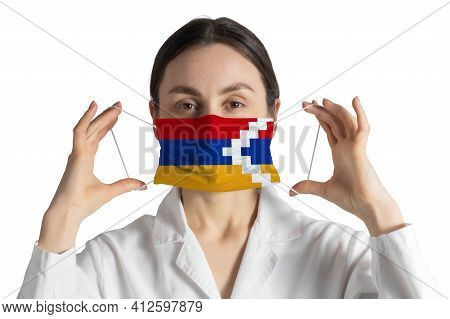 Respirator With Flag Of Nagorno-karabakh Republic Doctor Puts On Medical Face Mask Isolated On White