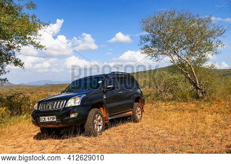 Taita Hills, Kenya - February 3, 2021: Black Offroad Car Toyota Land Cruiser Prado 120 At The Top Of