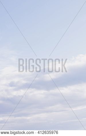 Natural Background Made Of Light Blue Spindrift Clouds At Daytime. Abstract Backdrop, Vertical Forma