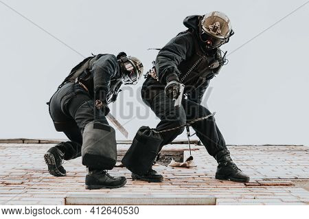 Two Commandos Train At The Base. Climbers. Swat, Police, Counterterrorism Concept. Mixed Media