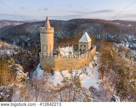 Aerial View Of Medieval Castle Kokorin In Winter During Sunrise. National Park Kokorinsko Nearby Pra