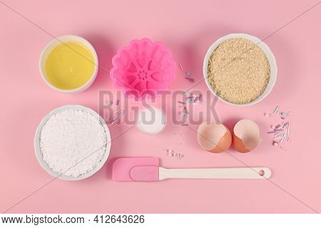 Baking Ingredients And Tools Like Powdered Sugar, Ground Almonds, Egg White, Salt, Sugar Sprinkles A