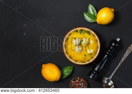 Avgolemono, A Greek Traditional Soup Made From Chicken Broth, Rice, Egg Yolks And Lemon. Flatlay On 