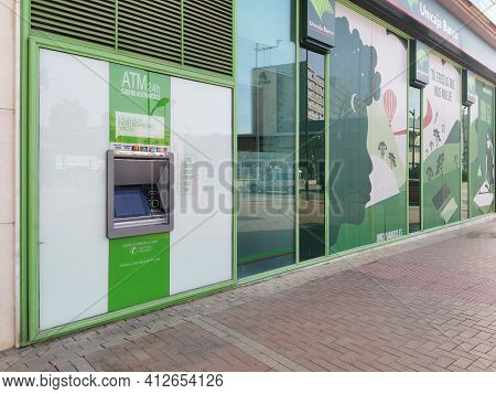 Málaga, Spain - February 18, 2021: View Of  The Unicaja Bank And Atm In Málaga Spain.