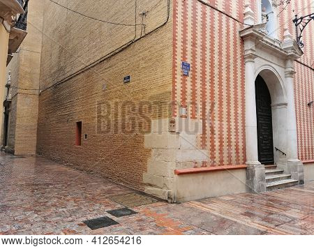 Málaga, Spain - February 21, 2021: View Of A Old Church On  Streets Málaga Downtown  In A Rainy Day