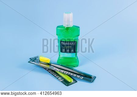Moscow, Russia - 9 Matra 2021: Mouthwash, Toothbrush On A Blue Background.the Concept Of Proper Oral