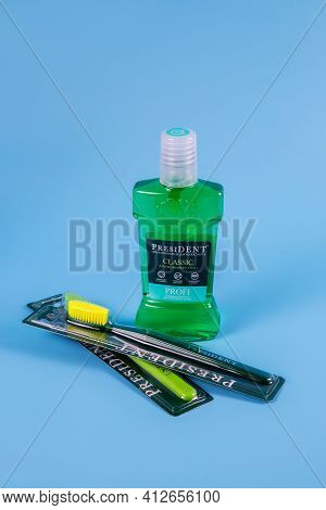 Moscow, Russia - 9 Matra 2021: Mouthwash, Toothbrush On A Blue Background.the Concept Of Proper Oral