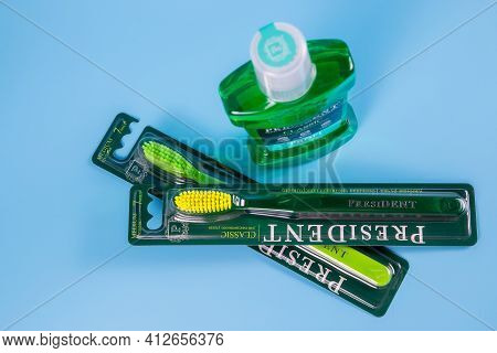 Moscow, Russia - 9 Matra 2021: Mouthwash, Toothbrush On A Blue Background.the Concept Of Proper Oral