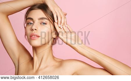 Mockup Of Young Woman With Nude Skin Posing Naked On Pink Background, Showing Natural Makeup And Hea