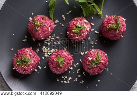 Georgian Beetroot Phali Or Pkhali With Walnuts, Garlic And On Black Plate