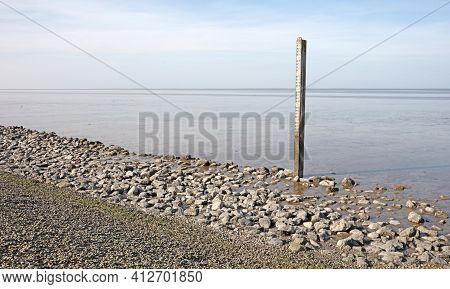 Old Water Level Gauge In The Netherlands, Waddensea