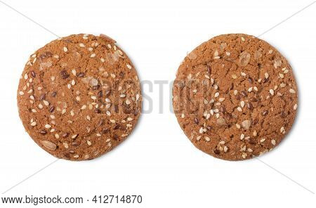 Top View Of Two Different Oatcakes With Sunflower And Flax Seeds Isolated On White Background.