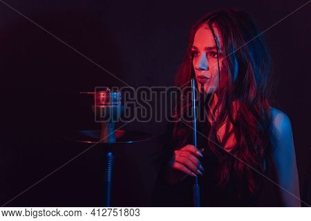 The Theme Of The Hookah, Sheesha. A Young Girl Gets The Pleasure Of Smoking Hookah