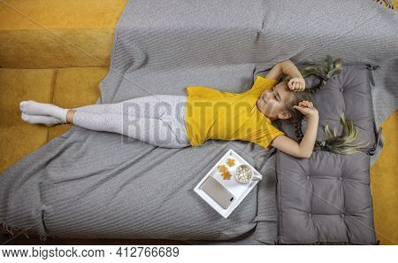 Girl Lying On The Bed, Enjoying Sweet Cookies And Dreaming, Digital Detox, Slow Living, Top View