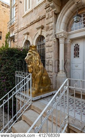 Jerusalem, Israel, February 27, 2021 : Evening View Of A Large Gilded Statue Of The Lion Of Jerusale