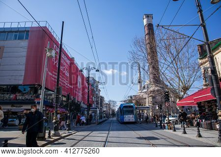 March 8, 2021 In Istanbul - Turkey Cemberlitas Square And Column. People And Mosques In The Historic