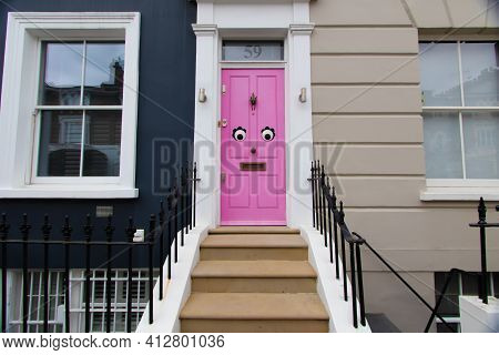 Portland Road, Notting Hill, London, England, United Kingdom - March 05 2021 Funny Pink Door In W11 
