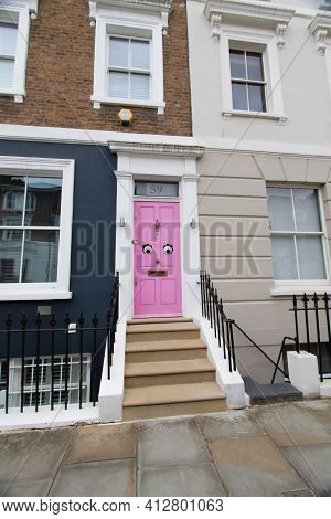 Portland Road, Notting Hill, London, England, United Kingdom - March 05 2021 Funny Pink Door In W11 