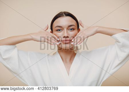 Young Woman Doing Face Building Facial Gymnastics Self Massage And Rejuvenating Exercises Touching L