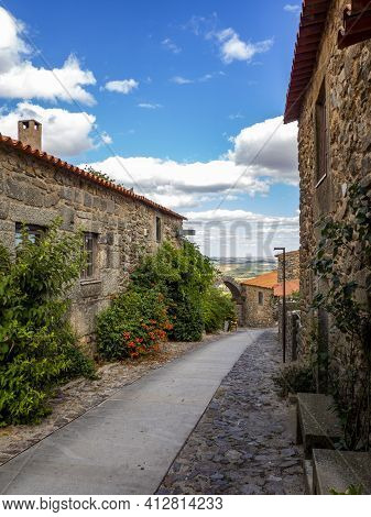 Castelo Rodrigo, Portugal - August  2020: View Of The Cobbled Street That Leads To The Gate Of The O