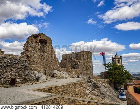 Castelo Rodrigo, Portugal - August  2020: View Of The Cobble Street Leading To The Clock Tower And T
