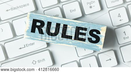 Word Rules. Wooden Small Cubes With Letters With Copy Space Available. Business Concept Image.