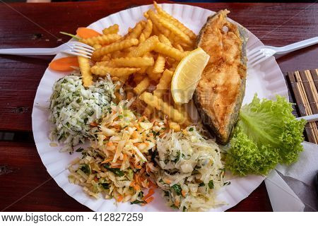 Fried Fish With Fries And Vegetable Salad