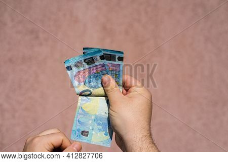 Hand Couting Holding And Showing Euro Money Or Giving Money. World Money Concept, 20 Euro Banknotes 