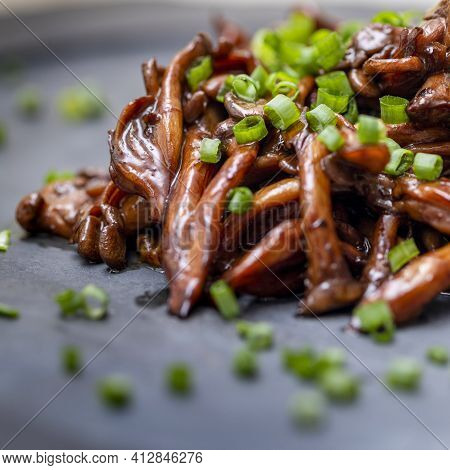 Shimeji Mushroom Served With Chives On Black Stone Plate. Typical Oriental Meal. Detail Of Food Dish