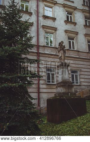 Old Statue In Front Of The Higher Theological Seminary In Przemysl, Poland. Wyzsze Seminarium Duchow