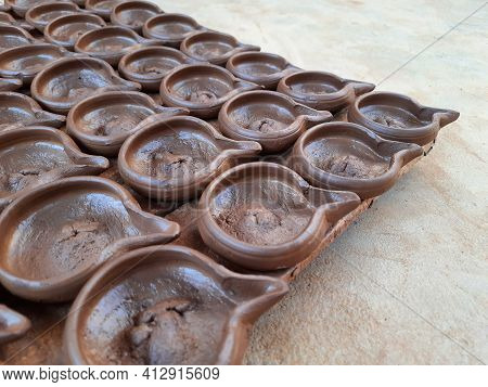 Abstract Pattern Texture Background Of Wet Handmade Sand Diya Or Oil Lamps