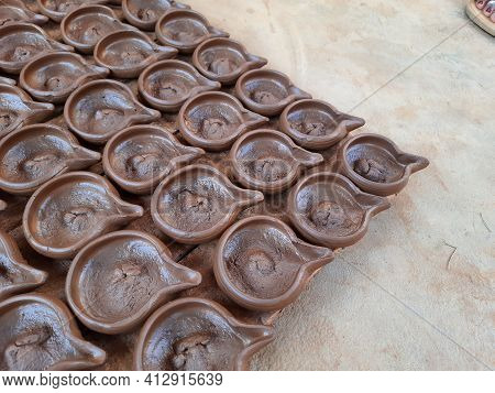 Abstract Pattern Texture Background Of Wet Handmade Sand Diya Or Oil Lamps