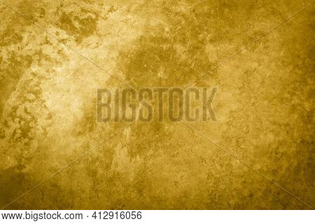 Textured Golden Stucco Background With Scratches, Scuffs And Stains. Plaster Backdrop Of Yellow Colo