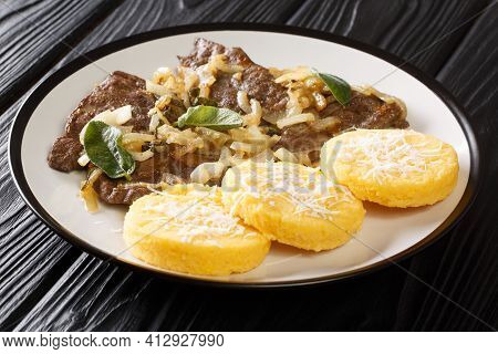 Venetian Style Calf Liver Fegato Alla Veneziana Closeup In The Plate On The Table. Horizontal