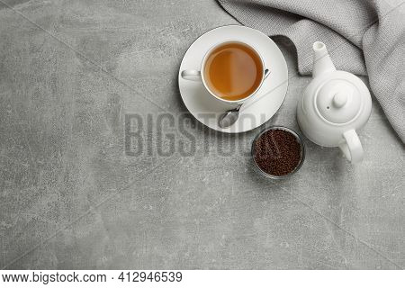 Buckwheat Tea And Granules On Grey Table, Flat Lay. Space For Text