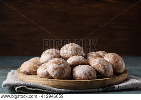 Plate With Tasty Homemade Gingerbread Cookies On Table. Space For Text