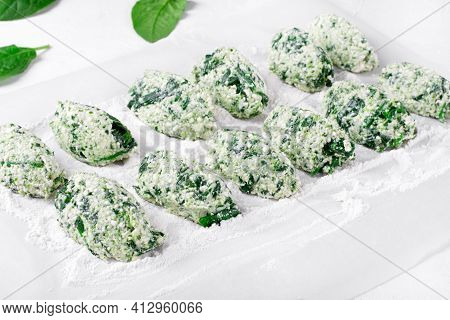 Cooking Gnudi With Ricotta And Spinach On White Board. Italian Meal