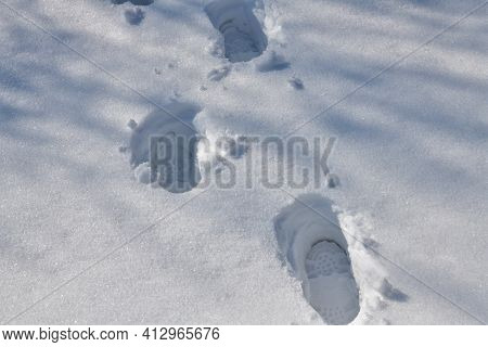Footprint Of A Man In Deep Snow On A Vast Snowy Landscape