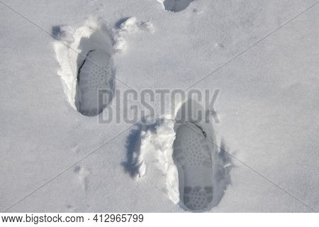 Footprint Of A Man In Deep Snow On A Vast Snowy Landscape